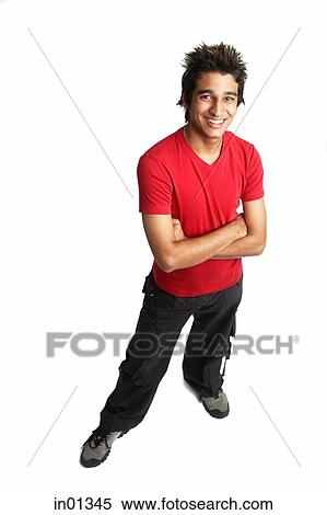 Man standing with arms crossed, smiling at camera View Large Photo Image Stock Photography - Man standing with arms crossed, smiling at camera. Fotosearch