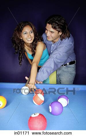 Man teaching woman how to play pool View Large Photo Image Stock Image - Man teaching woman how to play pool. Fotosearch
