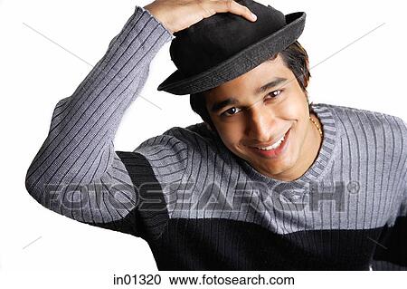 Man wearing hat, smiling at camera View Large Photo Image Stock Image - Man wearing hat, smiling at camera. Fotosearch
