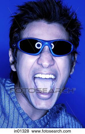 Man wearing sunglasses, shouting, tinted image View Large Photo Image Stock Photo - Man wearing sunglasses, shouting, tinted image. Fotosearch