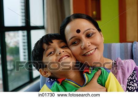 Stock Image - Mother embracing son. Fotosearch
