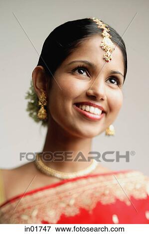 Portrait of woman in Indian sari, smiling View Large Photo Image Stock Photo - Portrait of woman in Indian sari, smiling. Fotosearch