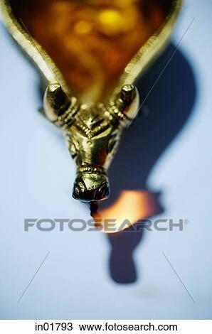 Still life of oil lamp with animal detailing View Large Photo Image Stock Image - Still life of oil lamp with animal detailing. Fotosearch