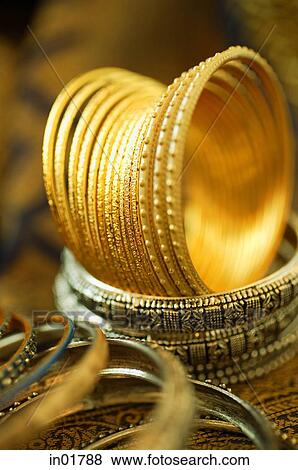 Still life with gold Indian bangles View Large Photo Image Stock Photo - Still life with gold Indian bangles. Fotosearch