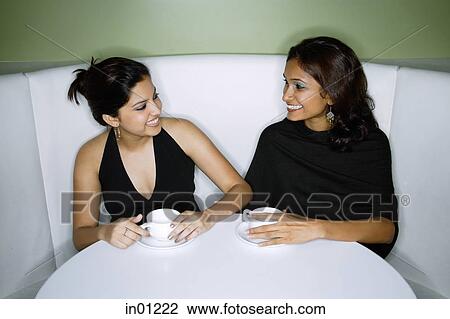 Two women having tea View Large Photo Image Stock Image - Two women having tea. Fotosearch