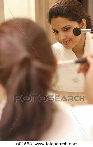 Woman applying blusher View Large Photo Image Stock Image - Woman applying blusher. Fotosearch