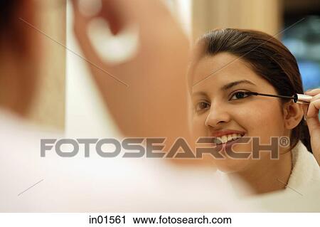 Woman applying mascara View Large Photo Image Stock Image - Woman applying mascara. Fotosearch