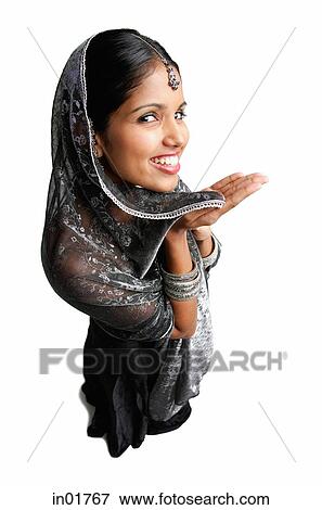 Woman in gray sari standing against white background, smiling up at camera View Large Photo Image Stock Photo - Woman in gray sari standing against white background, smiling up at camera. Fotosearch
