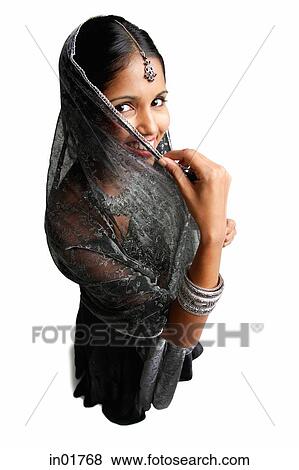 Woman in gray sari standing against white background, shielding face scarf View Large Photo Image Stock Photo - Woman in gray sari standing against white background, shielding face scarf. Fotosearch