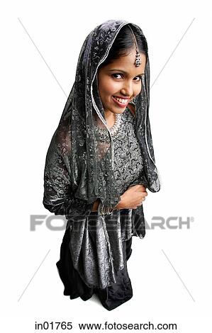 Stock Photography - Woman in gray sari standing against white background. Fotosearch