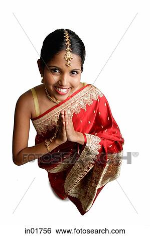 Woman in sari, standing with hands together, high angle view View Large Photo Image Stock Photograph - Woman in sari, standing with hands together, high angle view. Fotosearch