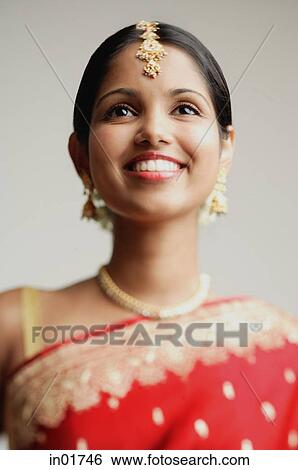 Woman in traditional Indian attire smiling, head shot View Large Photo Image Stock Photograph - Woman in traditional Indian attire smiling, head shot. Fotosearch