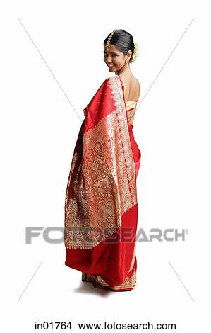 Picture - Woman in traditional Indian costume, looking over shoulder. Fotosearch