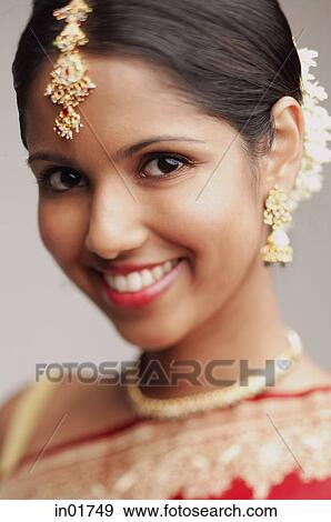 Woman in wearing Indian jewellery, smiling at camera View Large Photo Image Stock Photo - Woman in wearing Indian jewellery, smiling at camera. Fotosearch