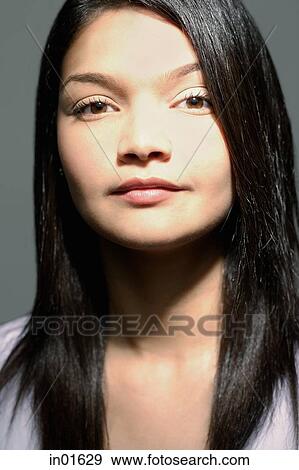 Woman looking at camera, portrait View Large Photo Image Stock Photo - Woman looking at camera, portrait. Fotosearch