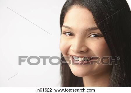 Stock Image - Woman looking at camera. Fotosearch