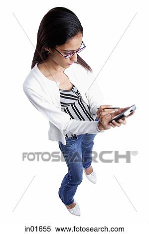 Woman looking at PDA View Large Photo Image Stock Photography - Woman looking at PDA. Fotosearch