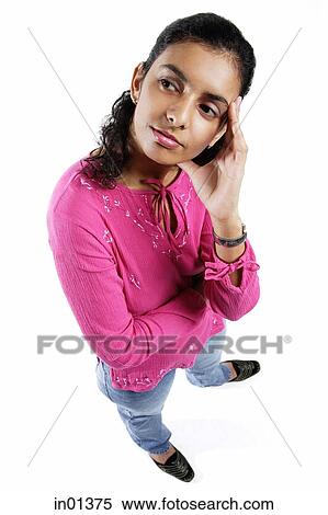 Stock Photography - Woman looking away, hand on head. Fotosearch