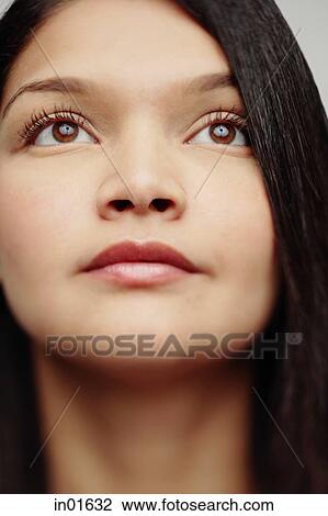 Woman looking away, head shot View Large Photo Image Stock Image - Woman looking away, head shot. Fotosearch