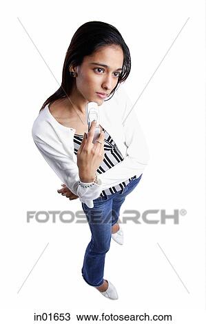 Woman looking away, holding mobile phone View Large Photo Image Stock Image - Woman looking away, holding mobile phone. Fotosearch