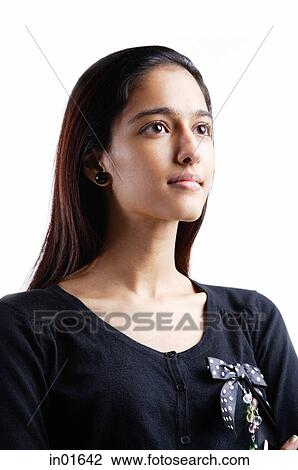 Stock Image - Woman looking away, portrait. Fotosearch