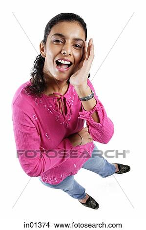 Picture - Woman looking up at camera, shouting. Fotosearch