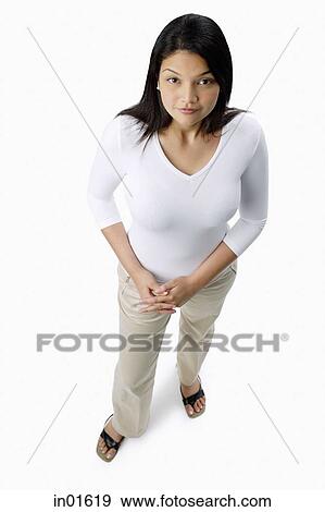 Stock Photo - Woman looking up at camera. Fotosearch