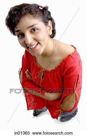 Stock Photography - Woman smiling at camera, arms crossed. Fotosearch
