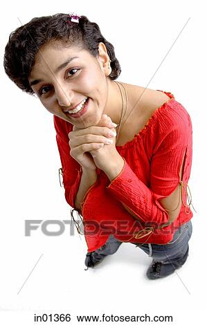 Woman smiling at camera, hands clasped under chin View Large Photo Image Stock Photograph - Woman smiling at camera, hands clasped under chin. Fotosearch
