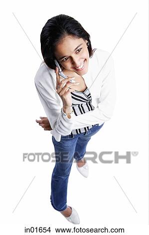 Woman using mobile phone, high angle view View Large Photo Image Picture - Woman using mobile phone, high angle view. Fotosearch