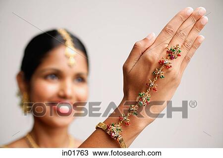 Woman with Indian hand jewellery, focus on the hand View Large Photo Image Stock Image - Woman with Indian hand jewellery, focus on the hand. Fotosearch