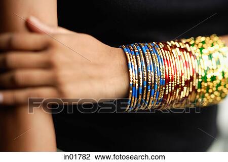 Woman's arm with colourful bangles View Large Photo Image Stock Image - Woman's arm with colourful bangles. Fotosearch