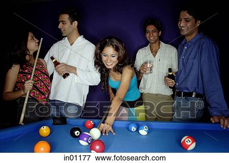 Stock Photo - Young adults playing pool and drinking beer. Fotosearch