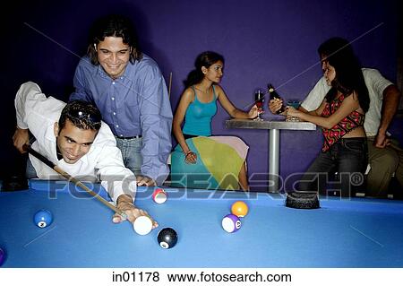 Young adults playing pool and drinking beer View Large Photo Image Stock Photo - Young adults playing pool and drinking beer. Fotosearch