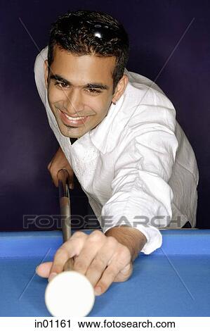 Young man aiming with pool cue View Large Photo Image Stock Image - Young man aiming with pool cue. Fotosearch