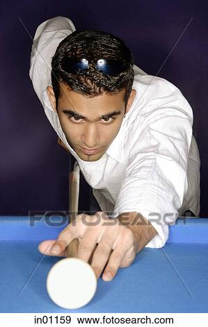 Young man playing pool, portrait View Large Photo Image Stock Photo - Young man playing pool, portrait. Fotosearch