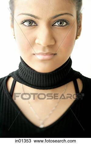 Young woman dressed in black, looking at camera View Large Photo Image Stock Image - Young woman dressed in black, looking at camera. Fotosearch
