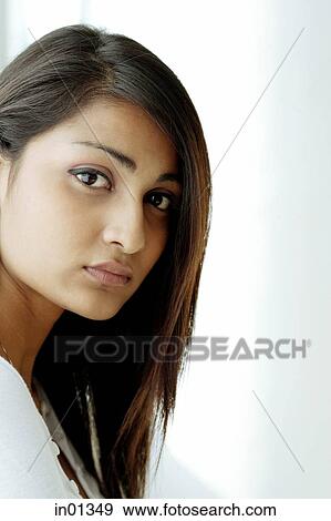 Stock Photo - Young woman with long hair, portrait. Fotosearch