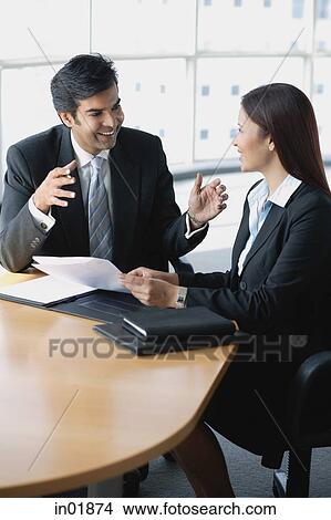 Businesspeople having a discussion View Large Photo Image Picture - Businesspeople having a discussion. Fotosearch