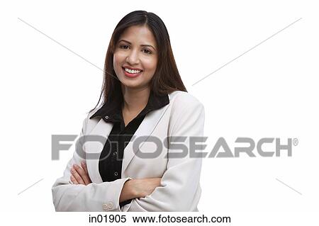 Businesswoman looking at camera, arms crossed View Large Photo Image Stock Photography - Businesswoman looking at camera, arms crossed. Fotosearch