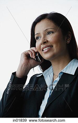 Businesswoman using mobile phone View Large Photo Image Stock Photo - Businesswoman using mobile phone. Fotosearch