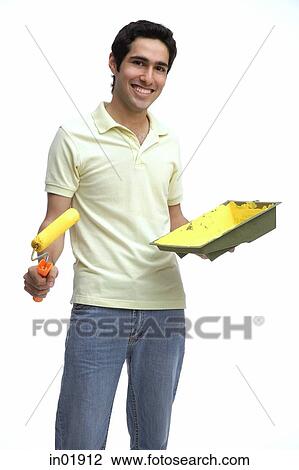 Man holding paint roller and paint tray View Large Photo Image Stock Image - Man holding paint roller and paint tray. Fotosearch