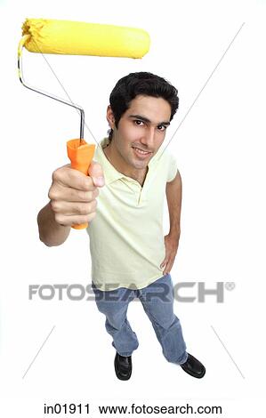 Man holding paint roller View Large Photo Image Stock Image - Man holding paint roller. Fotosearch