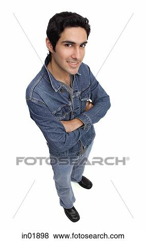 Man in denim jacket, arms crossed, looking at camera View Large Photo Image Stock Photo - Man in denim jacket, arms crossed, looking at camera. Fotosearch