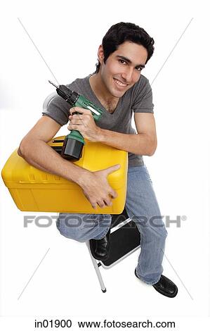 Man with toolbox and drill View Large Photo Image Stock Image - Man with toolbox and drill. Fotosearch