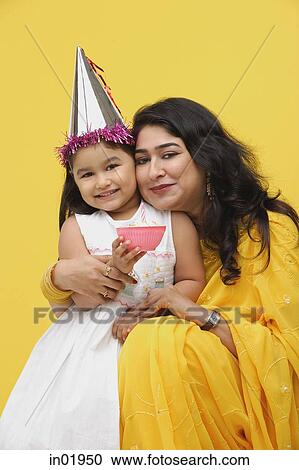 Mother embracing young daughter View Large Photo Image Stock Image - Mother embracing young daughter. Fotosearch