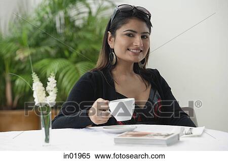Woman in cafe, having a coffee View Large Photo Image Stock Photography - Woman in cafe, having a coffee. Fotosearch