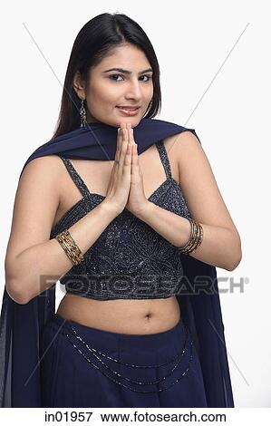 Woman in traditional Indian clothing, hands together View Large Photo Image Stock Photo - Woman in traditional Indian clothing, hands together. Fotosearch