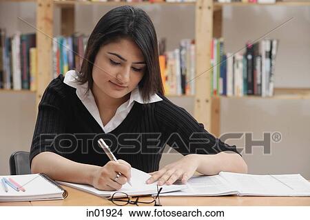Woman studying in library View Large Photo Image Picture - Woman studying in library. Fotosearch