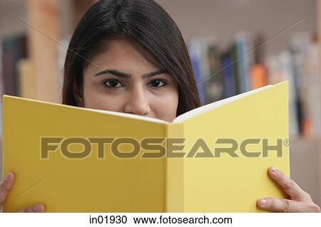 Stock Image - Woman with yellow book. Fotosearch